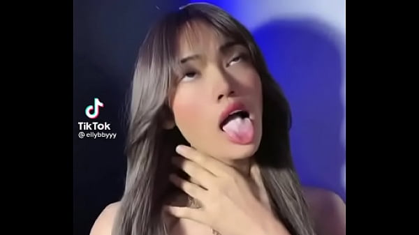 Big tits girl showing tounge with full cum