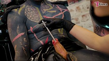 Latex Dominatrix Trio Sound & Finger the Tattooed Slave’s Cock