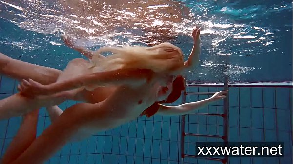 Milana and Katrin strip eachother underwater