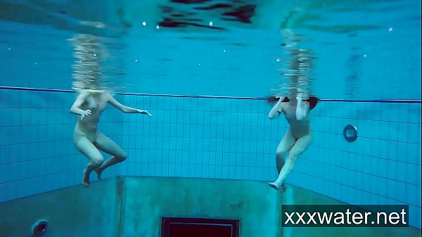 Milana and Katrin strip eachother underwater
