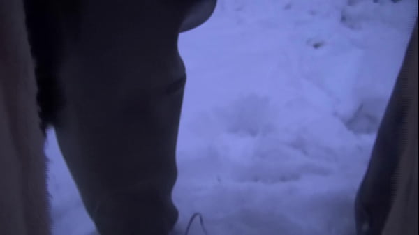 Bitch in the snow with long rubberboots on the feet