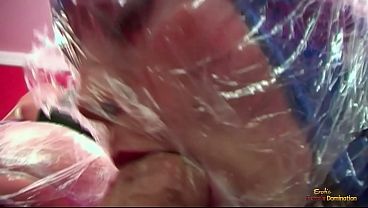 A bizarre bisexual threesome of latex fans looks almost surreal