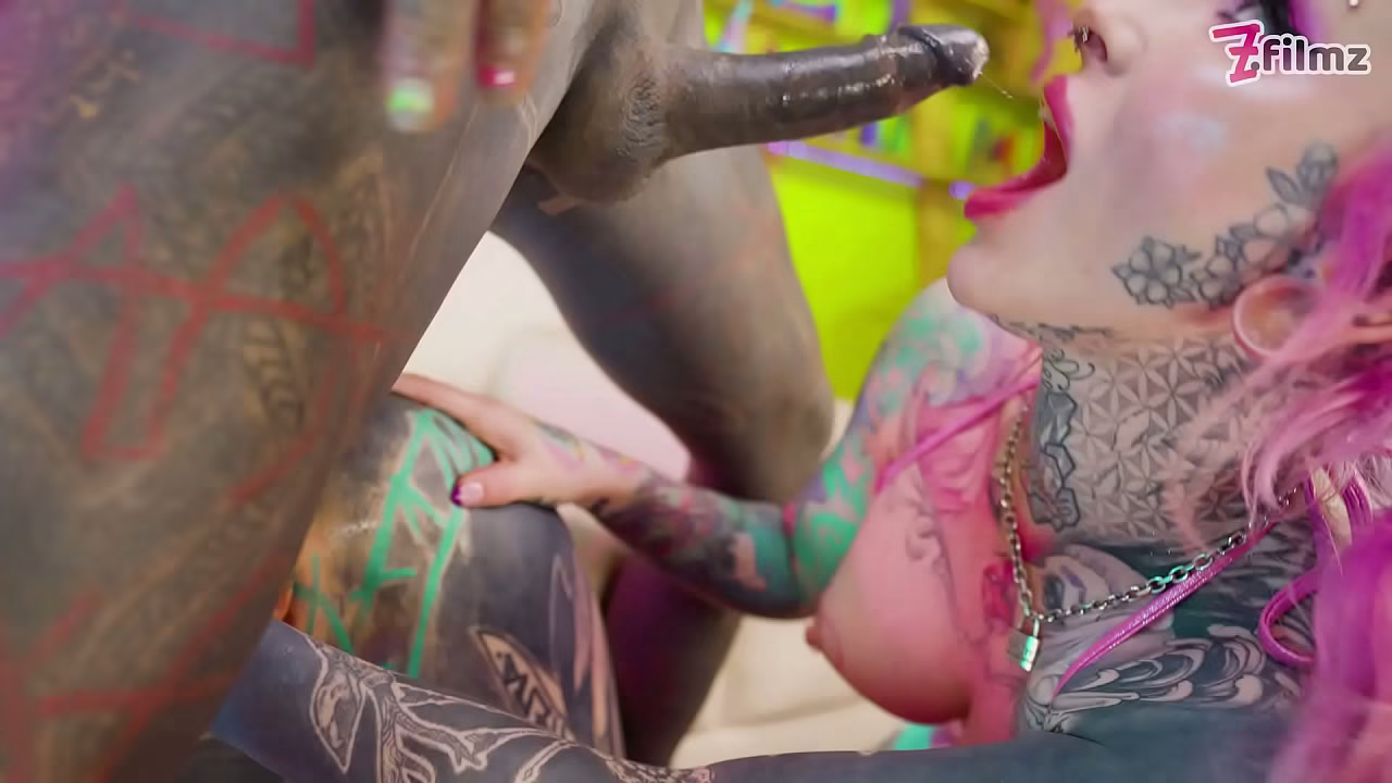 Inked Babes Pass Around a Massive Tattooed Dick