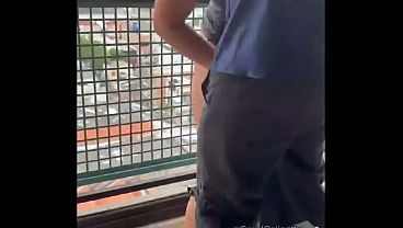 My neighbor fucked me on the balcony with everyone watching. I went to my neighbor's apartment, and when I got there, I saw his big, delicious cock, I couldn't resist. We fucked on the balcony and the cuckold just watched.