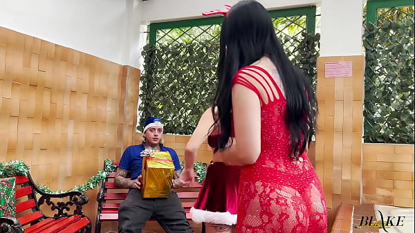 Two beautiful sluts in Christmas costumes sucking a lucky delivery man's cock