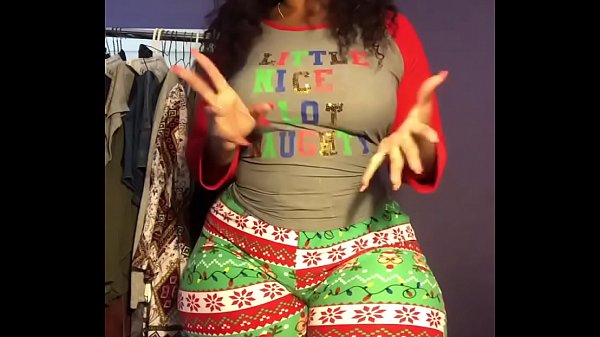 Cherokee D Ass stretching in Christmas leggings
