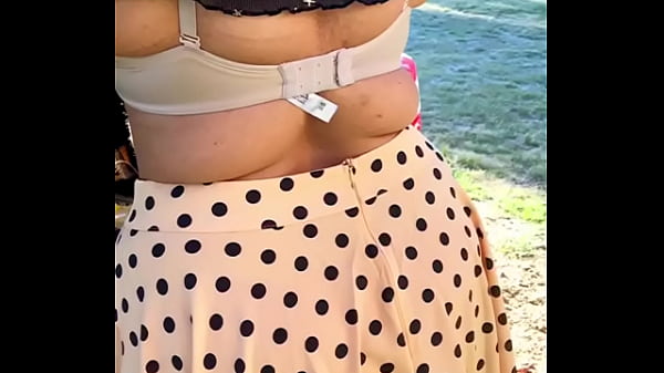 Sexy Girl dress in the Outdoor - flashes her bra cleavage