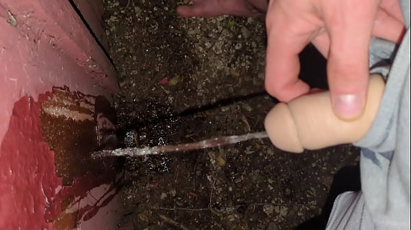 Transguy standing piss outside on wall stp