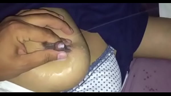 pressing & squeezing , spraying up milk from her breast