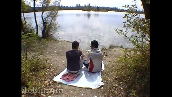 Download Video - Two buddies go down on each other on a river bank