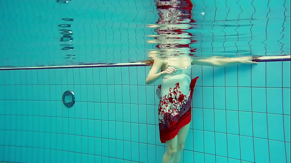 Hairy brunette teen Marketa underwater swimming