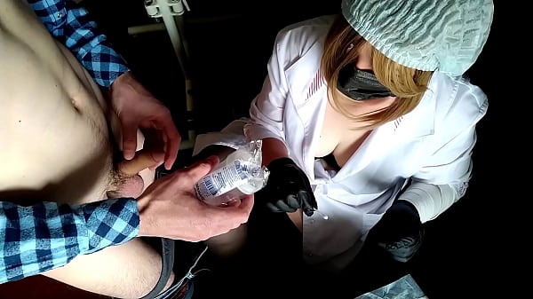 Female doctor examines a patient s penis