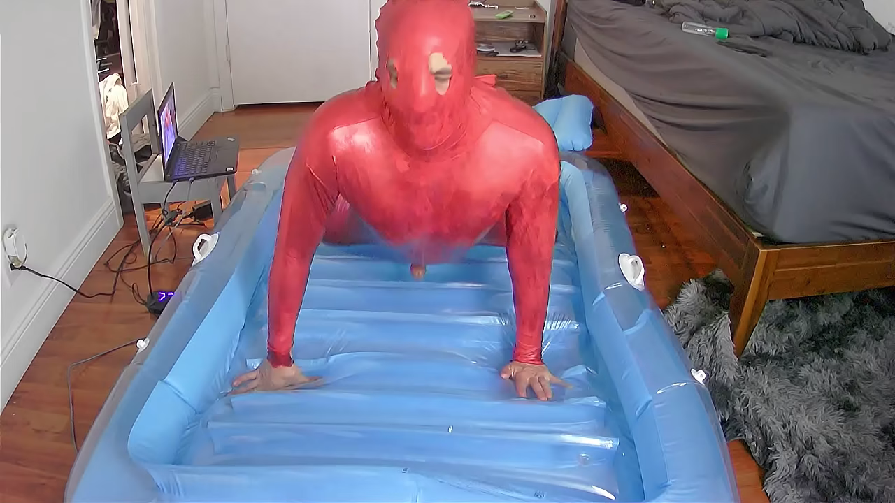 Inflatable oil catsuit fuck