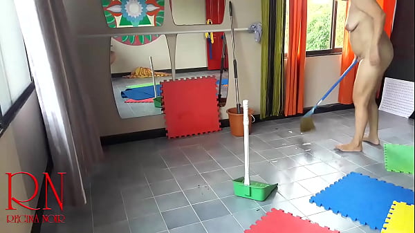 Nudist maid cleans the yoga room. A naked cleaner cleans mirrors, sweeps and mops the floor. CAM 1