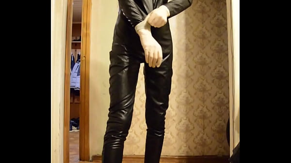 I change into a shiny black suit and jerk off i...
