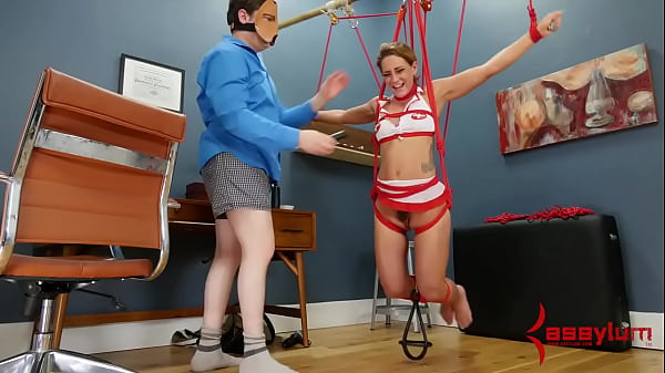 Bound slut gagging on toy