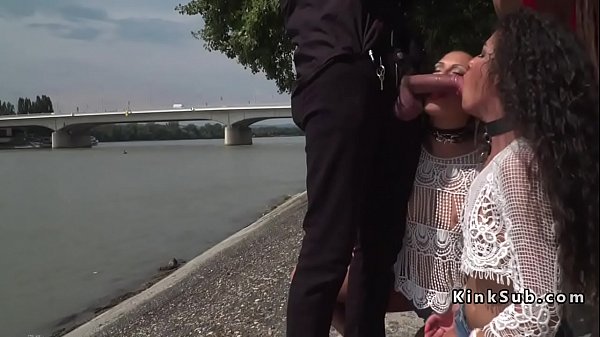 Two slaves face fucked by the river