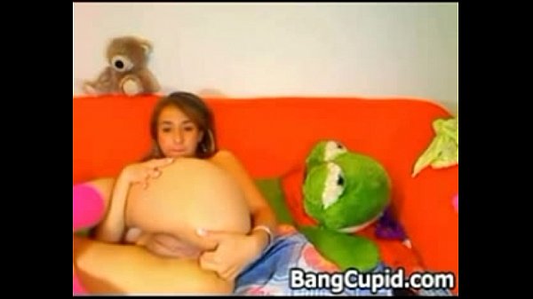 Busty babe fingers and toys her ass