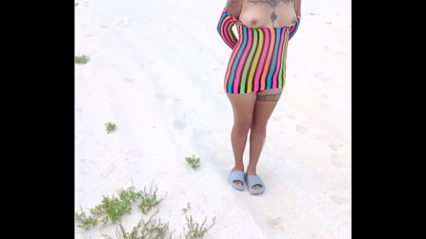 Latina showing off on a public beach in Mexico