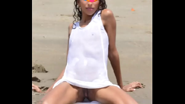 Nude model in a public beach photoshoot. Small tits nice ass