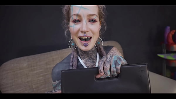 Tattoo slut sinks a thick metal toy deep into her hole