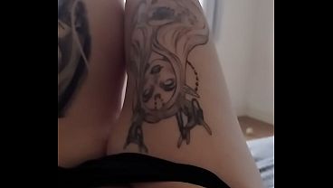 Tattooed cat masturbates in front of the window.