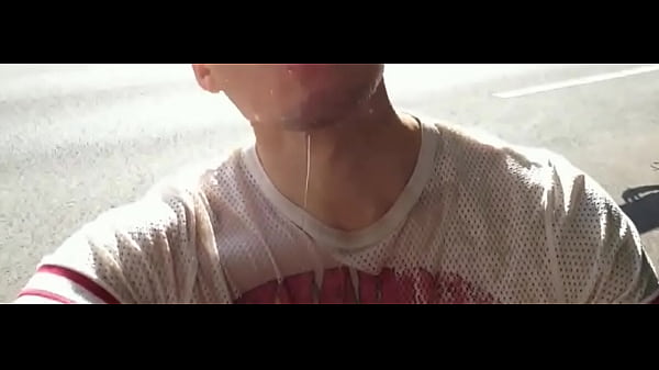 Piss shower daytime next to main road