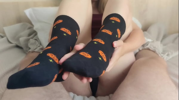 Footjob in black Halloween socks