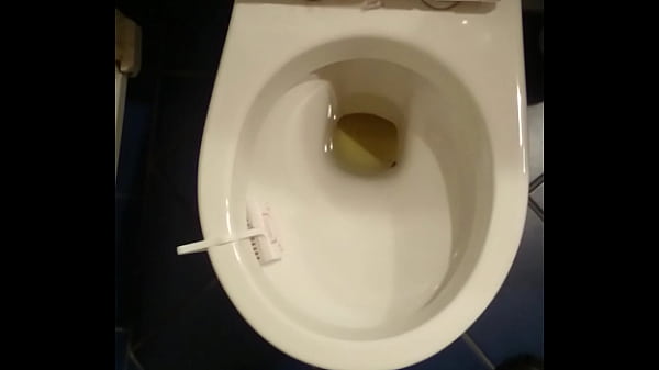 Guy pissing in toilet