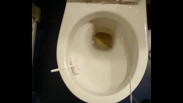Guy pissing in toilet