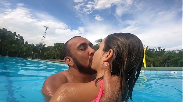 Hot kissing the little bitch in the pool before some wet sex