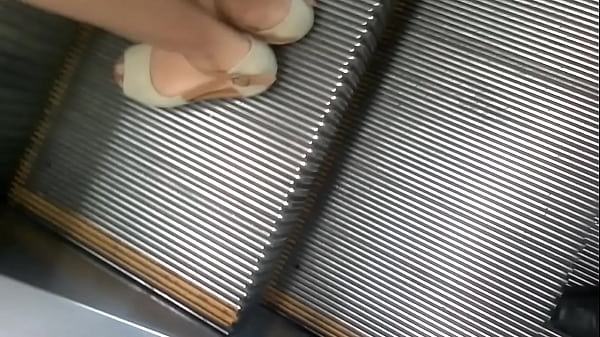 Upskirt at electric stair