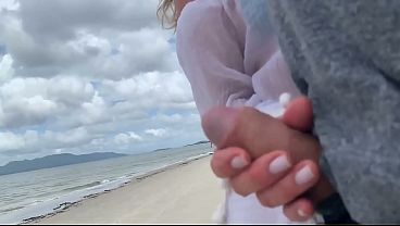 A stranger milf gives me a handjob in front of everyone.