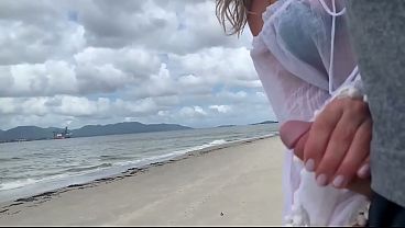 A stranger milf gives me a handjob in front of everyone.