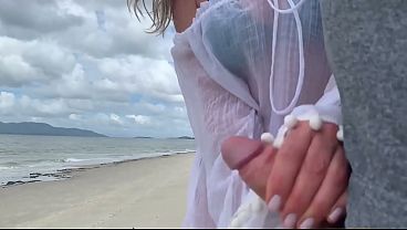 A stranger milf gives me a handjob in front of everyone.