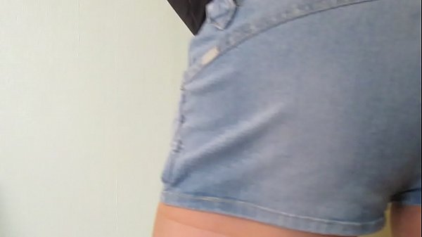 denim shorts and tan tights crossdresser