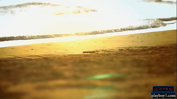 Four lesbian girlfriends enjoy each other on the beach