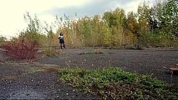 Outdoor pissing. A MILF urinates while walking in a public park and by the sea.