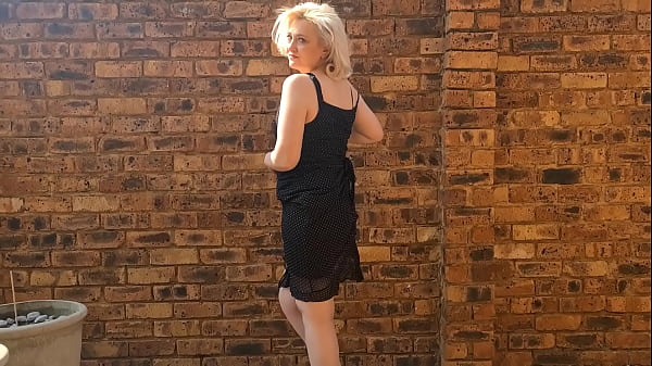 Download Video - Striptease and Piss by chubby Mature naked blonde outside in the garden courtyard