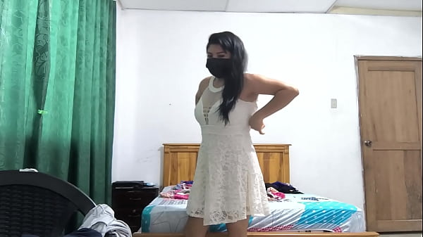 The busty executive chooses a white dress and then starts making sensual movements, showing her beautiful vagina.