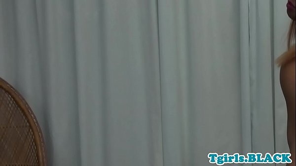 Transsexual ebony wanking her stiff dick