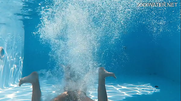 Eyla Moore, a famous model, glides elegantly through the water
