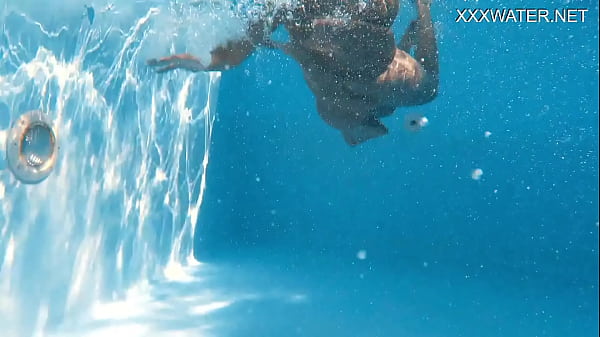 Eyla Moore, a famous model, glides elegantly through the water