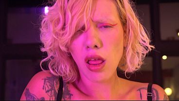 Busty blonde gives a blowjob and handjob backstage