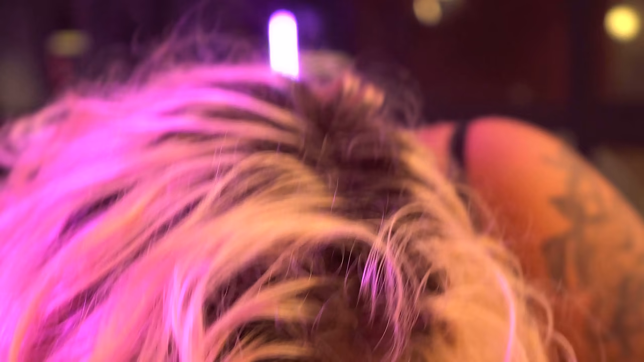 Busty blonde gives a blowjob and handjob backstage