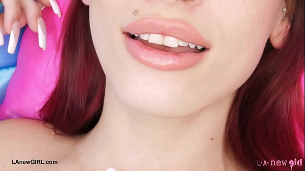 Striking red-haired beauty shows her sexy body