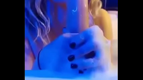 Russian beauty Hanna relaxes in the Jacuzzi and plays with her pussy