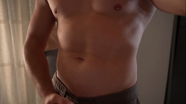 Strong guy posing at camera and cums on his belly