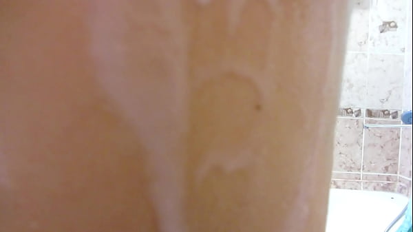 Brunette masturbates in the bathroom and shows her soapy pussy, clitoris and tits in close-up. Homemade fetish.