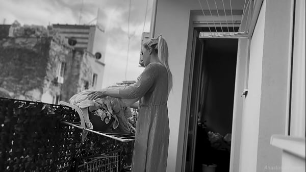Naked chubby woman hangs out laundry on the balcony for neighbors can watch